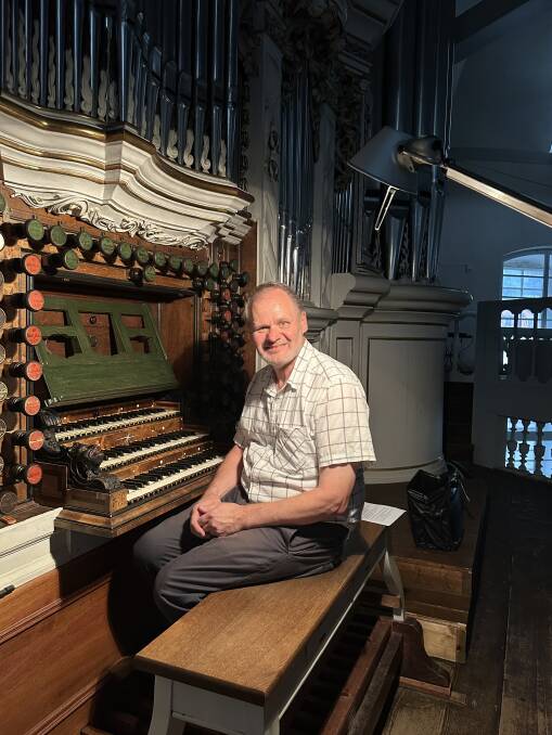 Clinical Professor Lieschke at Waltershausen, Germany, sitting at the 1730 Trost organ in the Stadtkirche.