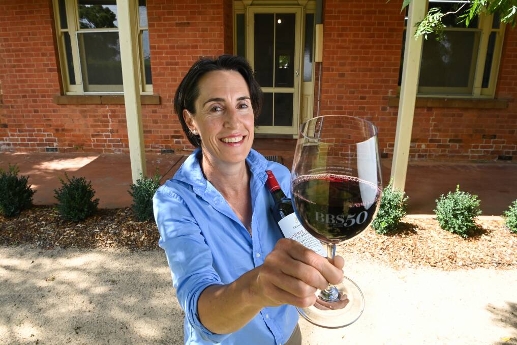 GOLDEN JUBILEE: Jane Campbell raises a glass to the 50th vintage of Bobbie Burns Shiraz at the Bobbie Burns Homestead. Picture: MARK JESSER