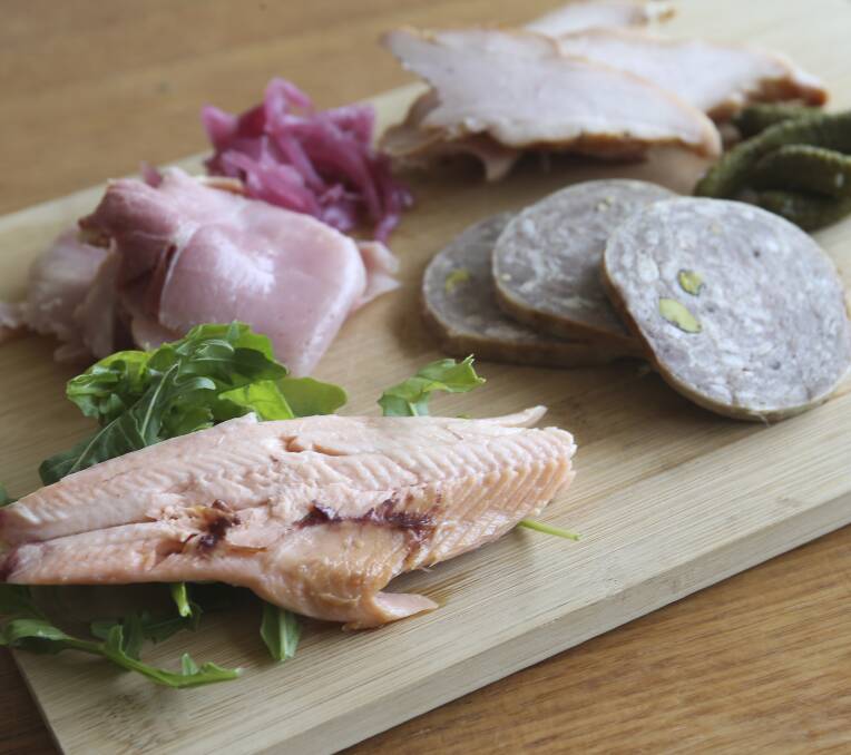 LOCAL FARE: Pork duck neck sausage, Harrietville smoked trout, smoked chicken and Nuss, a smoked pork delicacy.