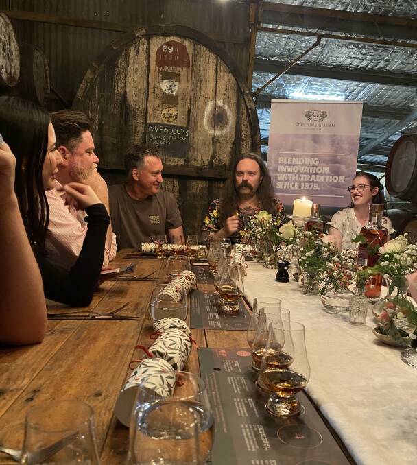 Westward Whiskey master blender Miles Munroe, centre back, speaks to The Whisky Club and Stanton and Killeen stakeholders at the Rutherglen winery on Friday.