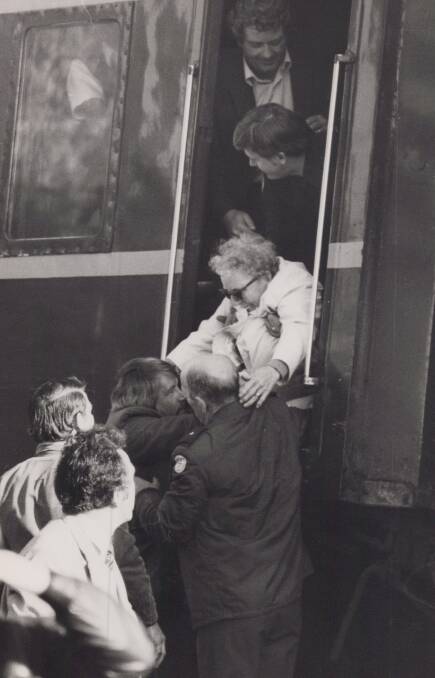 Passengers are helped down from the Spirit of Progress after the crash at Barnawartha 40 years ago.