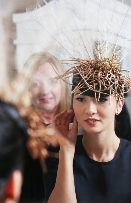 TURNING HEADS: South Albury milliner Tania Scott, pictured overlooking her Albury Gold Cup creation on model Ebony Tai, is among participating businesses in Get Race Ready at Murray Art Museum Albury tonight.