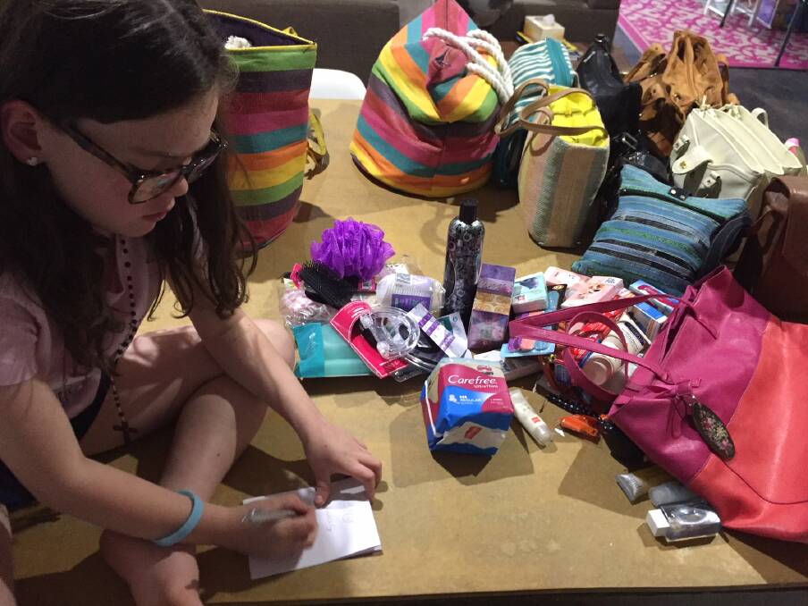SWEET WORK: Jindera's Isla O'Brien, 6, writes notes to recipients of Share the Dignity bags, which are destined for homeless women or victims of domestic violence on the Border in the lead-up to Christmas this year. 