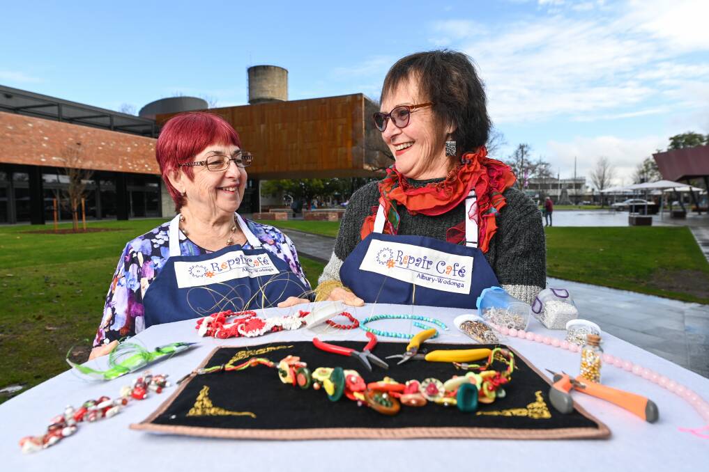FIX IT: Volunteers Michele Campbell and Jan Hastings offer jewellery repairs at Repair Cafe Albury-Wodonga. Picture: MARK JESSER