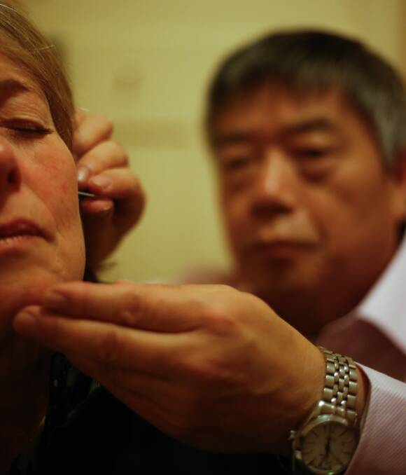 FINER POINTS: Baranduda's Kathryn Harris gains relief from her allergies through Chinese herbs and acupuncture from Chinese Medicine physician Dr James Liu at Wodonga Chinese Medicine Clinic. Picture: MARK JESSER