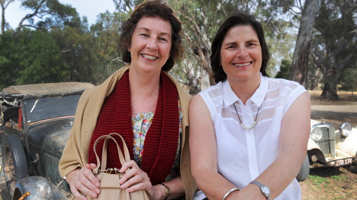 CREATIVE TEAM: Rosalie Ham, dressed as an extra on the set of The Dressmaker, with producer Sue Maslin.