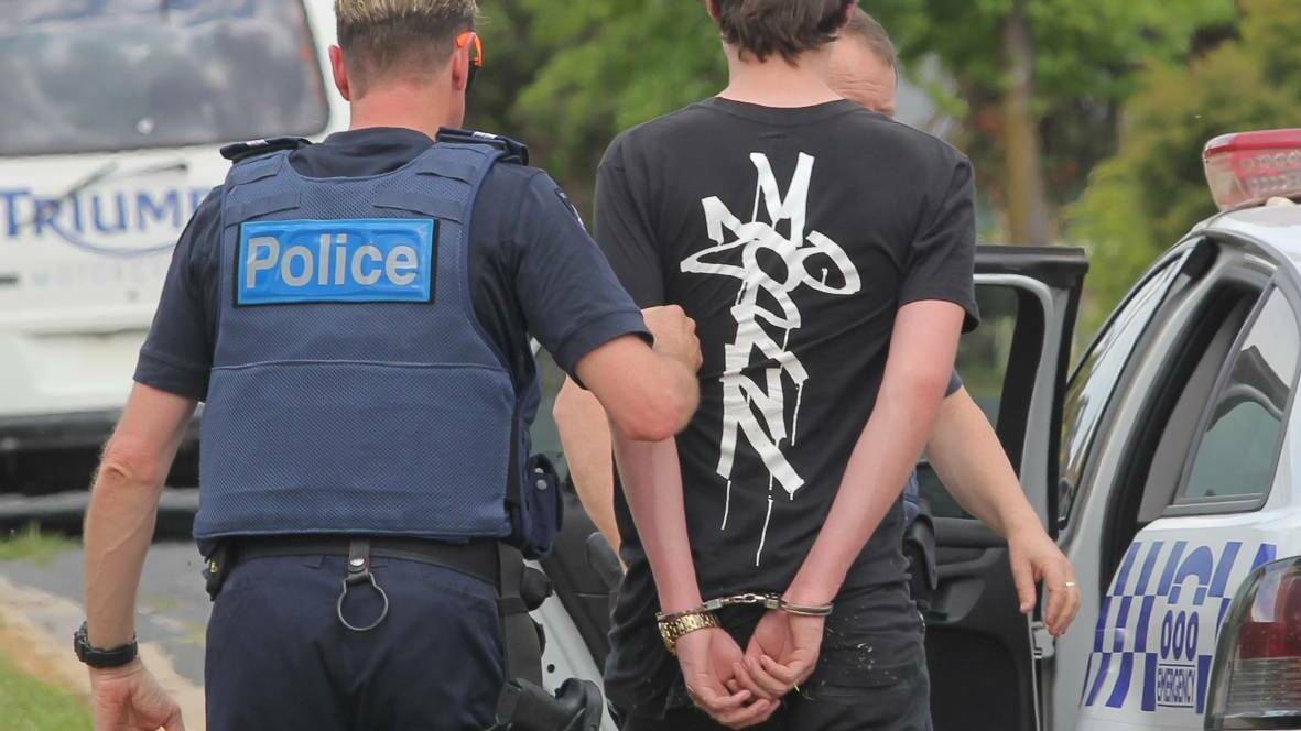 CAUGHT: A teenager is taken into custody in Wodonga on Tuesday afternoon. Picture: BLAIR THOMSON