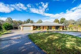 Set on 1.29 acres tucked away from the world, be enchanted driving up to the gorgeous sandstone home with wrap around verandahs. Pictures supplied.
