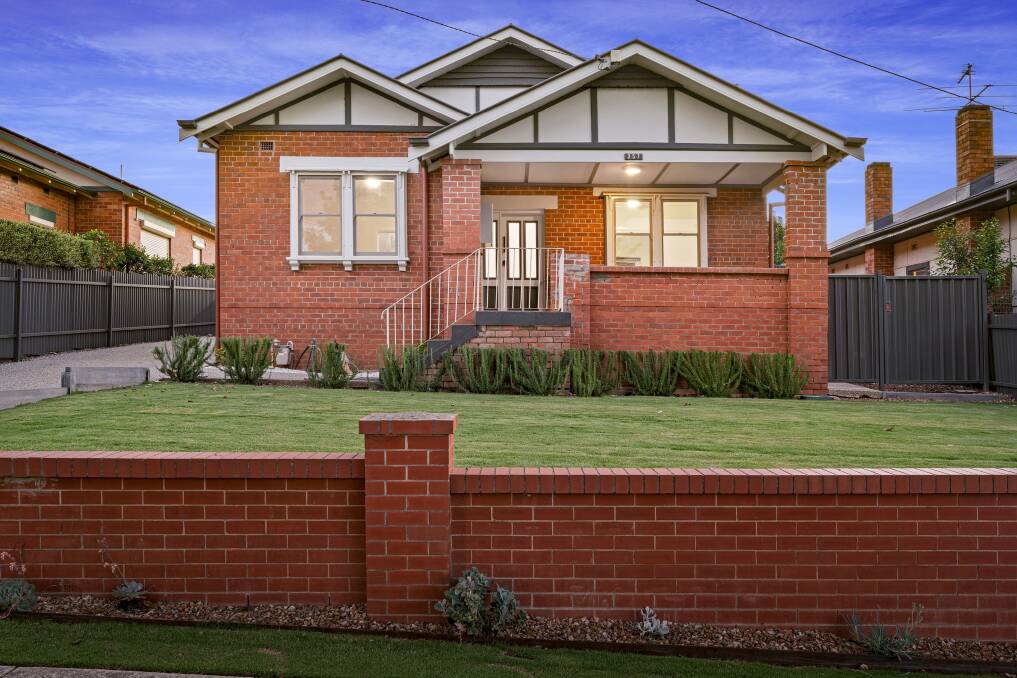 The exterior showcases the enduring appeal of classic red brick, with a verandah overlooking manicured lawns, neatly nestled behind a red brick fence. Picture supplied.
