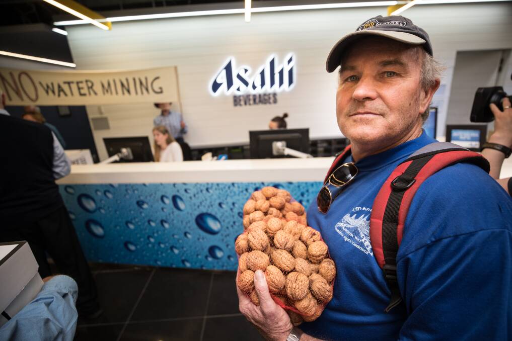 Stanley Farmer David McIntyre was part of a protest with other locals delivering fruit to the head office of Asahi. Picture: JASON SOUTH