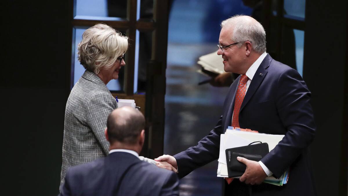 SOMETIMES THEY GET ALONG: Indi MP Helen Haines and Prime Minister Scott Morrison in Parliament in July, in a kinder moment. Picture: ALEX ELLINGHAUSEN