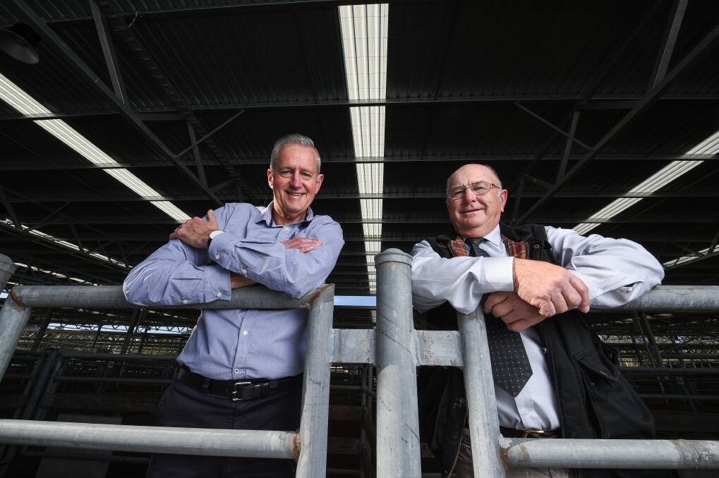 RENEWABLE REGION: Countrywide Energy director Geoff Drucker and deputy mayor Harvey Benton, who said Wangaratta could have one of the greenest saleyards going around. Picture: MARK JESSER