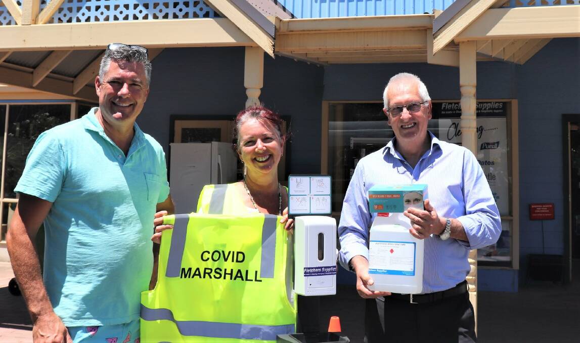 SAFETY FIRST: Wangaratta mayor Dean Rees, Everton Australia Day committee's Angela Ross and Clarke Fletcher providing the supplies.