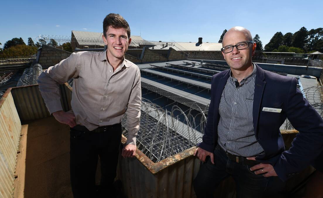 SOLAR SWITCH: Old Beechworth Gaol's Clayton Neil and Indigo Power managing director Ben McGowan with the new solar panels on old architecture. Pictures: MARK JESSER