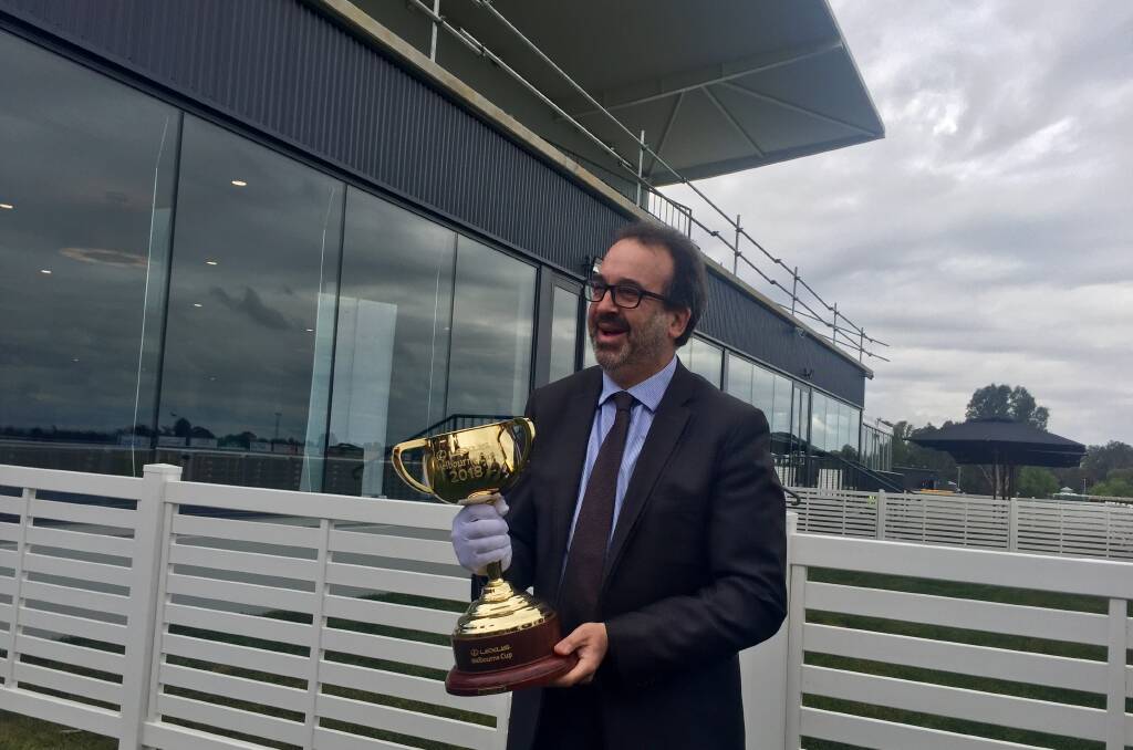 CUP THAT STOPS A NATION: Victorian Racing Minister with the 2018 Melbourne Cup in front of the new Wangaratta Racecourse grandstand. Picture: SHANA MORGAN
