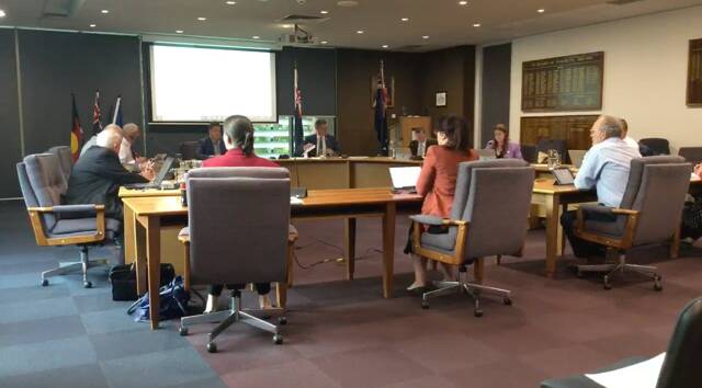 EXTRA SPACE: Wangaratta Council broadcast over livestream, with extra space between their chairs.