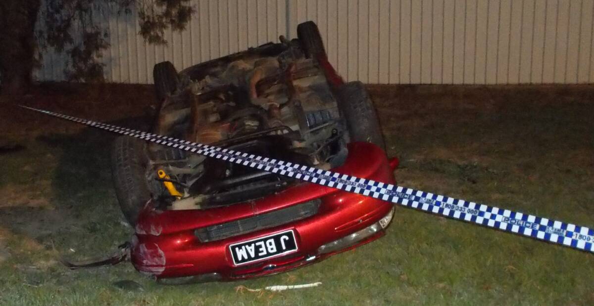 END RESULT: The car with the novelty number plate "J BEAM" was found flipped onto its roof.