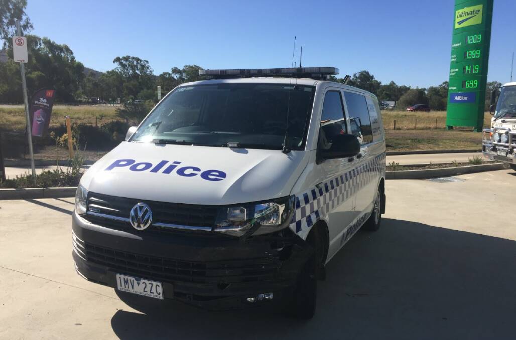 COPPED A BLOW: This police crime scene van was damaged on its front passenger side and needed to be towed away from the service station.