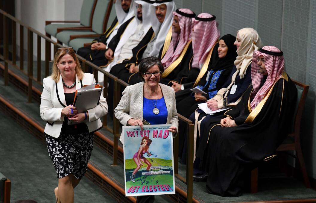 DON'T GET MAD: Rebekha Sharkie and Cathy McGowan with the 1997 poster created to encourage women to run for a seat in Parliament. Picture: AAP