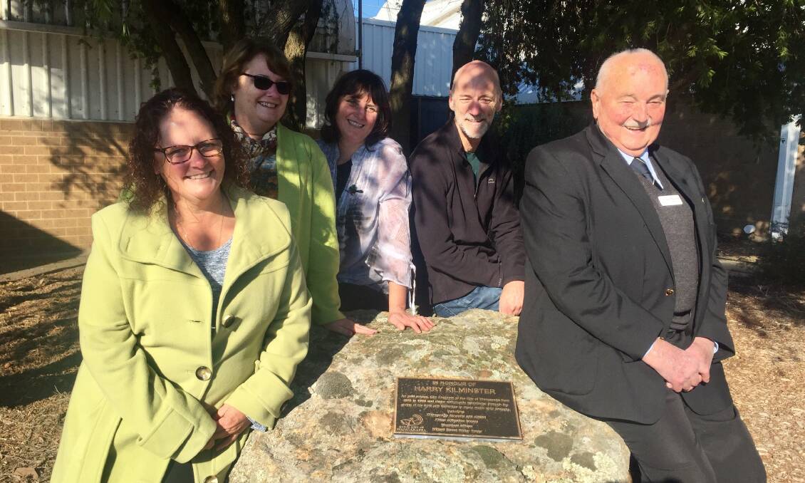 HONOURED: Harry Kilminster's children Myrene, Anne, Jenni and Geoff Kilminster and mayor Ken Clarke with the plaque at Wangaratta Airport, unveiled on Saturday.