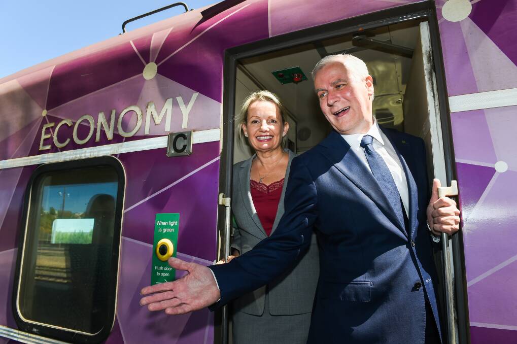 READY TO ROLL: Farrer MP Sussan Ley and Deputy Prime Minister Michael McCormack at Thursday's announcement at Albury Rail Station, promising to "get on board and move it along quickly”. Pictures: MARK JESSER