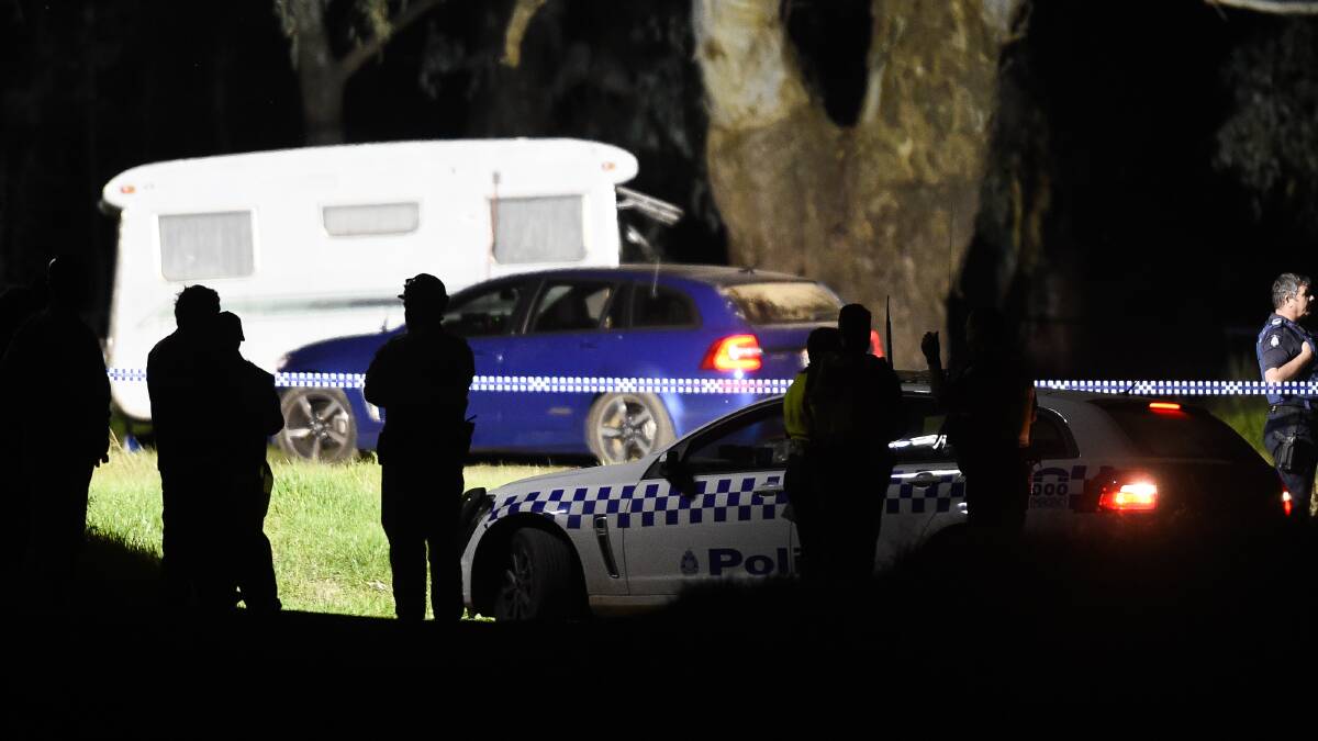 WORRIES: Police searched the area near the caravan. Pictures: MARK JESSER