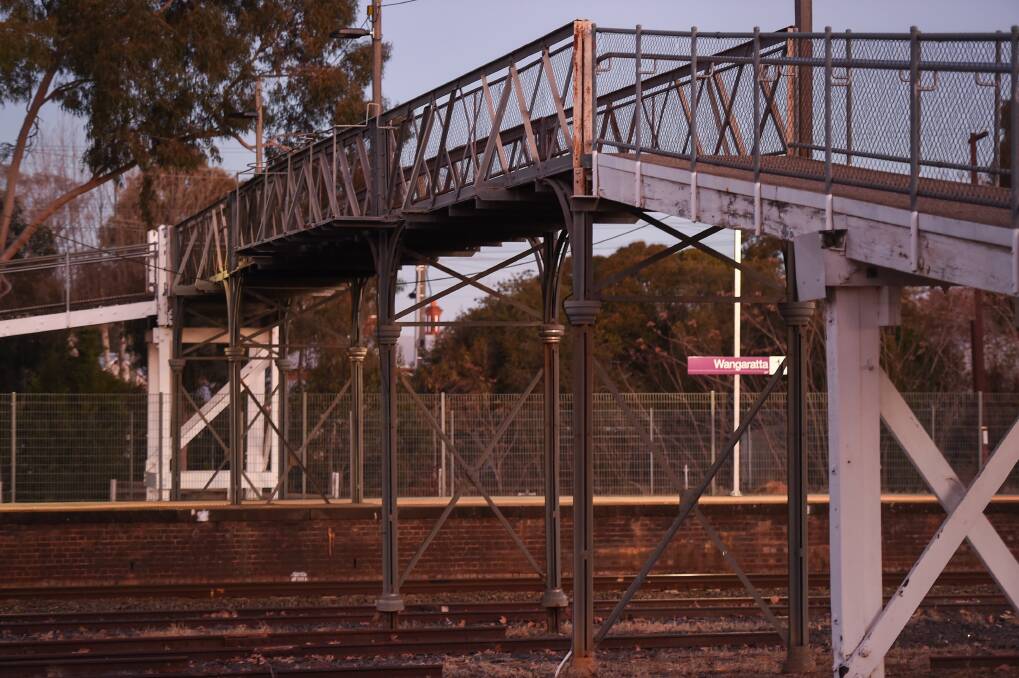 TOO SHORT: Tim McCurdy says there has been community opposition to a plan to remove two footbridges, one built in 1888, as part of the inland rail project.