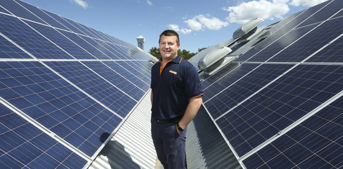 GOOD BUSINESS: Yackandandah FoodWorks owner Nick Cook is proud of new solar panels on the store's gabled roof. Picture: ELENOR TEDENBORG