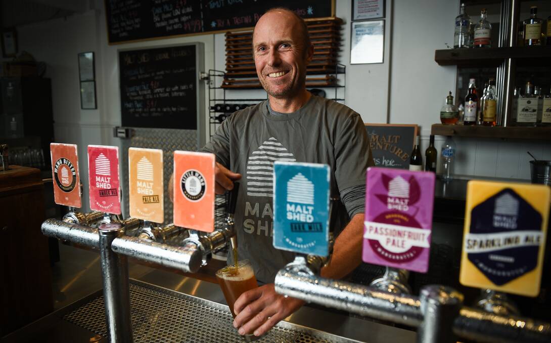 GOOD FOR BUSINESS: Malt Shed co-owner Andrew Bett with the "Little Wang" mid strength beer. Brewing the beer will soon attract less excise tax. Picture: MARK JESSER