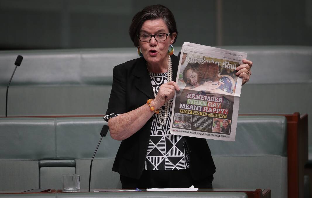 A GAY DAY: Cathy McGowan holds up The Border Mail in Parliament to show the region's support for marriage equality. Picture: ALEX ELLINGHAUSEN