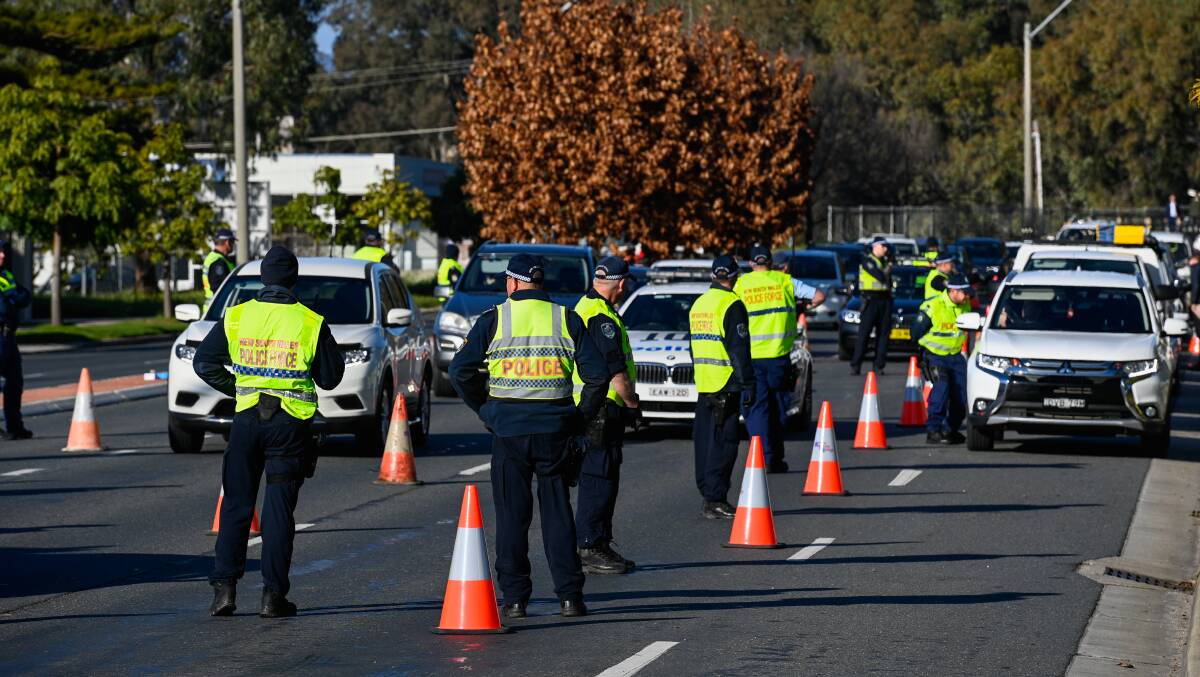 CHECKPOINT: NSW Police on the Lincoln Causeway on Wednesday morning. Picture: MARK JESSER
