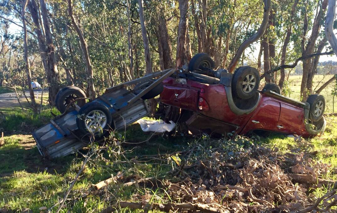 CRASH SCENE: The driver was lucky to survive after his Mitsubishi Triton ute flipped onto its roof. Pictures: SHANA MORGAN