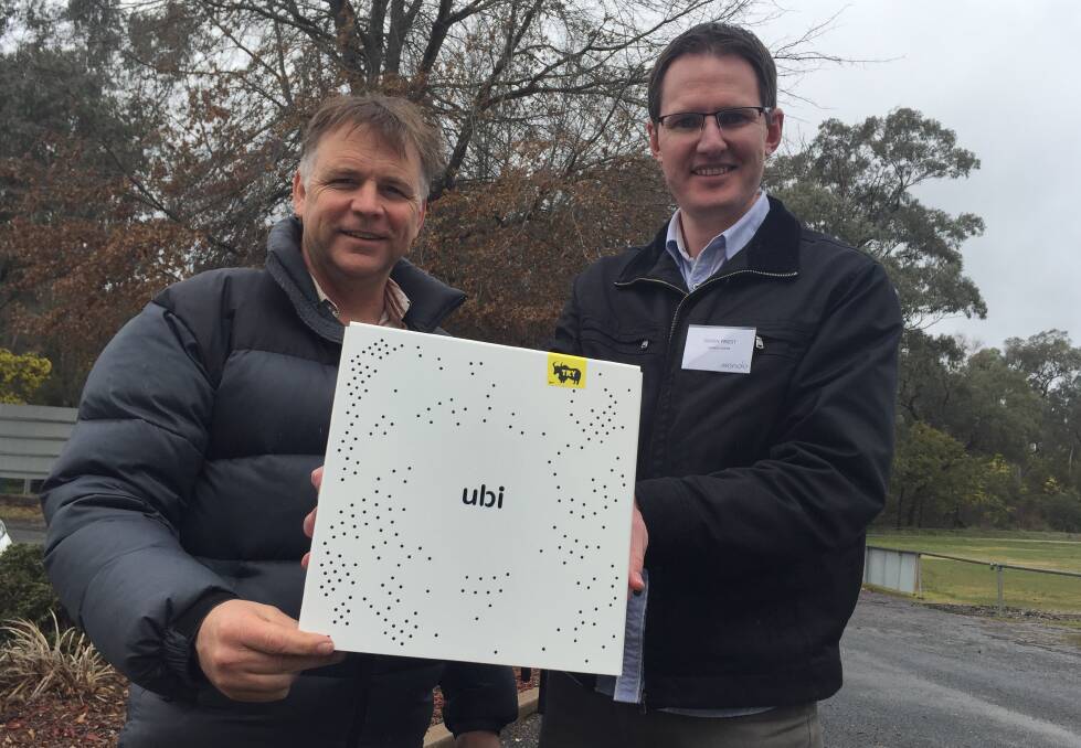 INNOVATIVE TECHNOLOGY: Totally Renewable Yackandandah co-chair Matthew Charles-Jones and Mondo acting project manager Simon Priest with the "ubi" device.