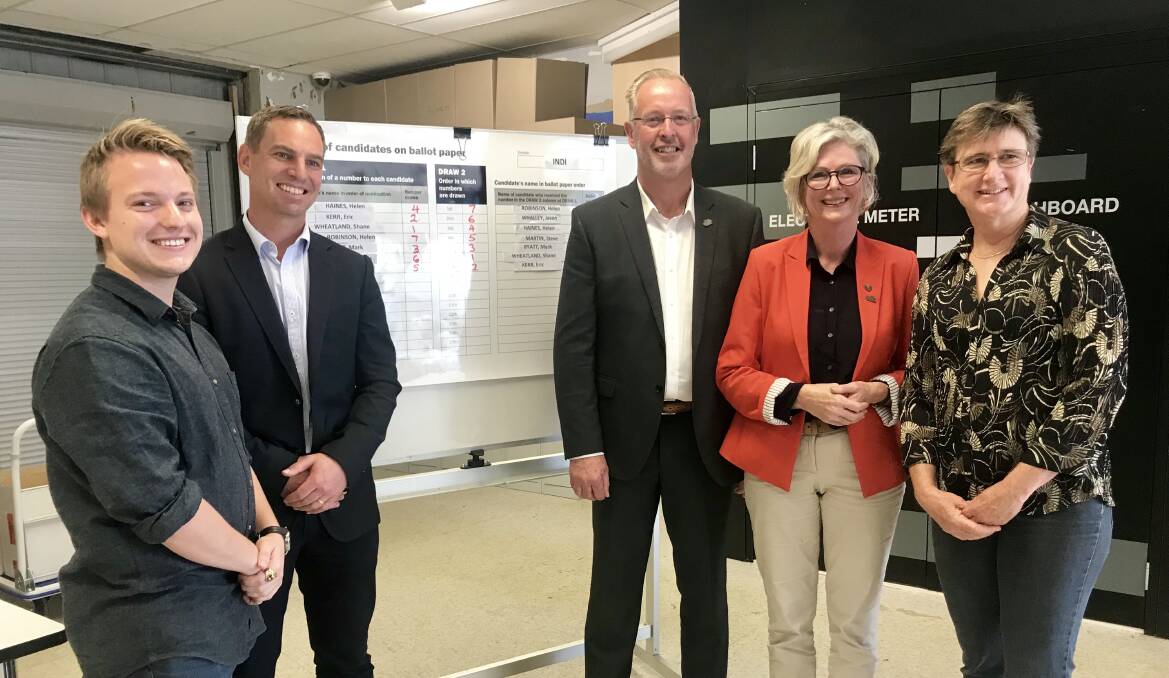 STARTING LINE: Eric Kerr, Steve Martin, Mark Byatt, Helen Haines and Helen Robinson at the ballot draw in Wangaratta on Wednesday.