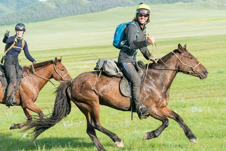 WINNERS: Annabel Neasham and Adrian Corboy racing in the Mongol Derby. Picture: MONGOL DERBY