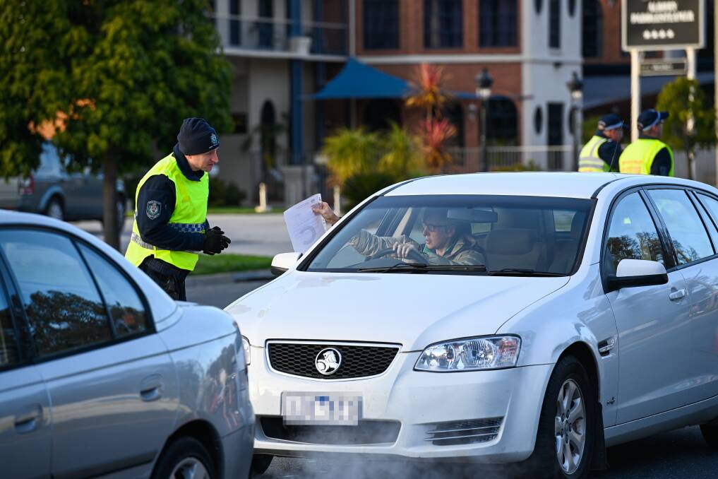 TICKET TO RIDE: NSW Premier Gladys Berejiklian confirmed more than 50,000 permits to cross the border were issued on Tuesday night and yesterday morning. Motorists had them printed to show to police. Picture: MARK JESSER
