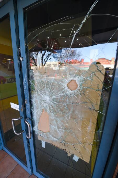 SMASHED: The damage caused on the Border on Thursday night included this smashed window at Intencity at Albury's Recent Cinema. Picture: MARK JESSER