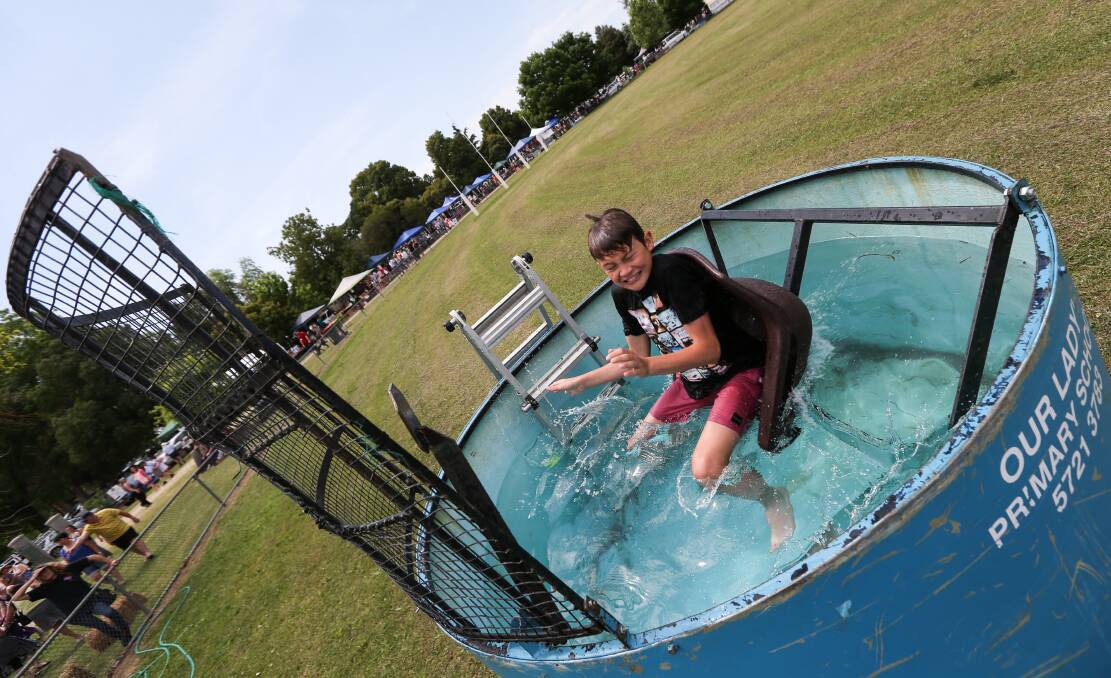 WILLING VOLUNTEER: After the dignitaries had their turn, Thomas Cappellari, 11, put his hand up for the Whorouly Town Fair water dunk.