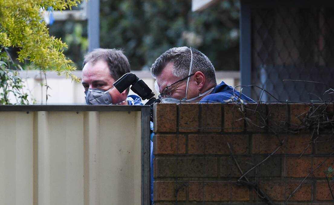 BODY DISCOVERED: Police in the yard of Darcy McNamara's home where Nathan Day's body was found buried on September 5, 2018.