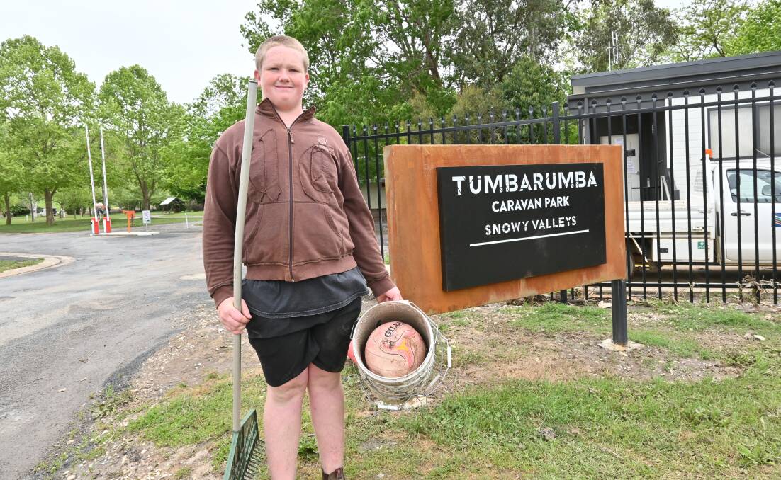 TUMBA TROOPER: Zack Morris, 13, spent the weekend clearing up debris that had washed up onto the streets. He also rescued several trout that had become stranded in puddles. Picture: KENJI SATO