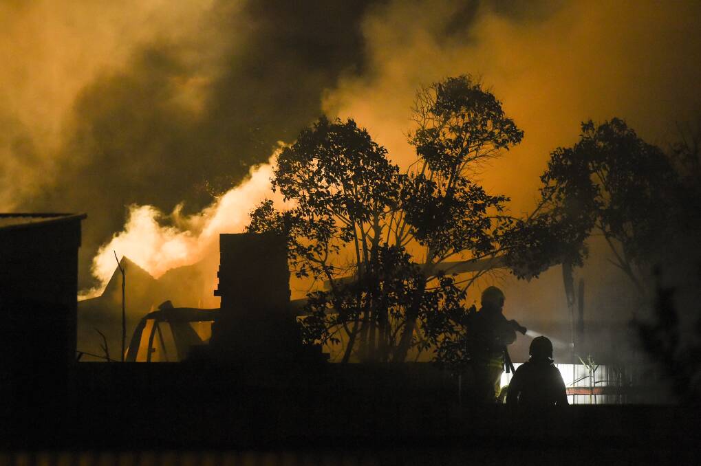 EMERGENCY SCENE: The shed on fire on Mate Street. Pictures: MARK JESSER, VIVIENNE JONES and BLAIR THOMSON