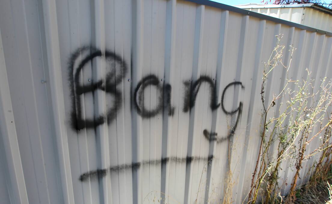THREATS: A large amount of graffiti has been sprayed on and around Pearce Street in Wodonga in recent months, ranging from angry threats to apologies. 