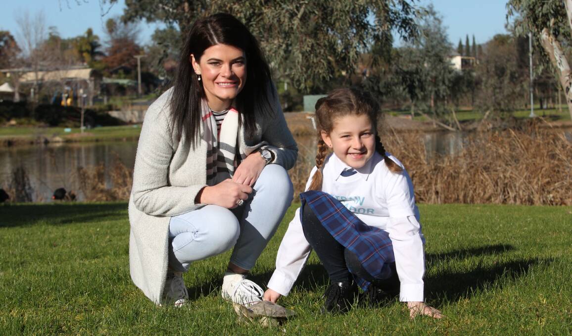 PROTECT THE TURTLES: Councillor Kat Bennett, seven-year-old Charlie Erlewein and four-year-old pet turtle Franklin. Picture: SHANA MORGAN