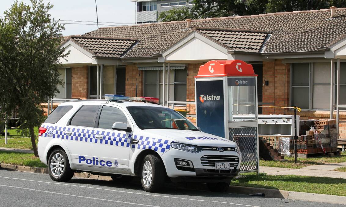 CRIME SCENE: Police at on the corner of Lawrence and William streets in Wodonga, where construction provided the alleged offender with a wooden plank for an assault.