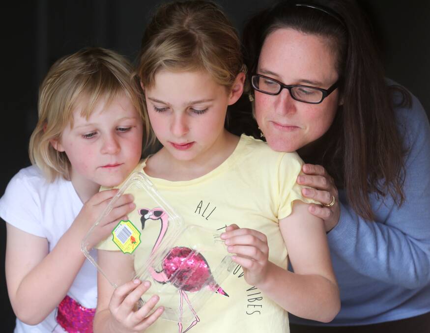 FRIGHTENING: Lisa Church with daughters Amelia, 5, and Sophie, 8, who found a sewing pin embedded in a strawberry in a punnet purchased in Lavington. Picture: KYLIE ESLER