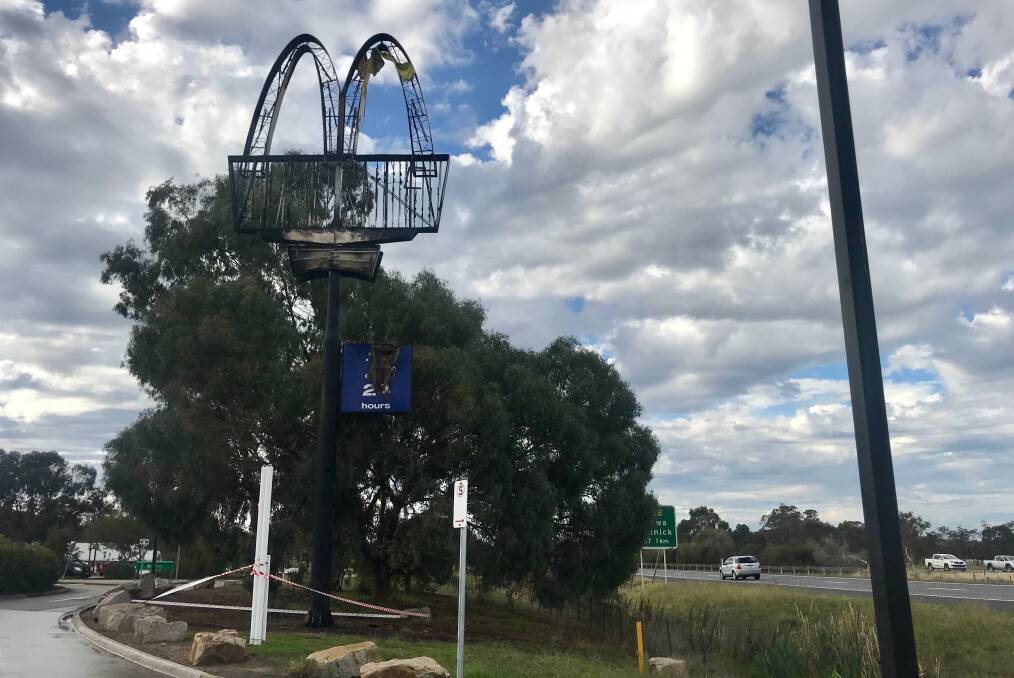 WELL DONE: The charred McDonald's sign on the Hume Freeway.