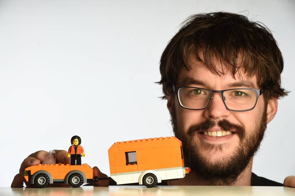 BRICK CATHY: Orange is a rare colour for Lego pieces, but Andrew Shaw has found enough to create a good Cathy McGowan likeness and her iconic car and caravan to add some fun to the Indi campaign. Picture: MARK JESSER