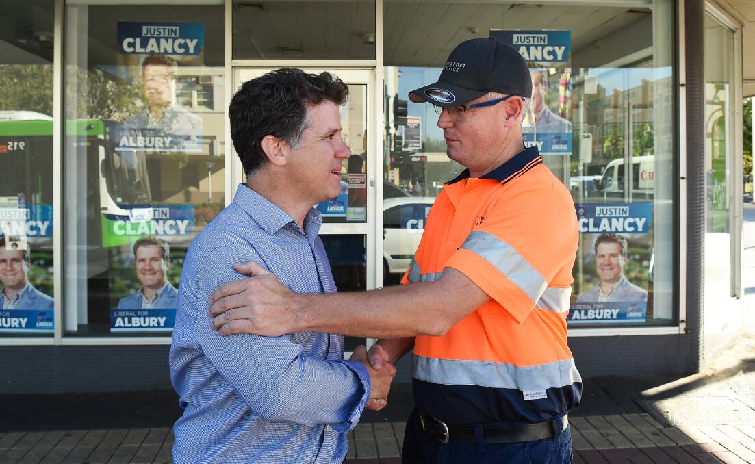 SEALED WITH A HANDSHAKE: Justin Clancy said he was grateful for the support of Nico Matthews ahead of Saturday's NSW election. Picture: MARK JESSER