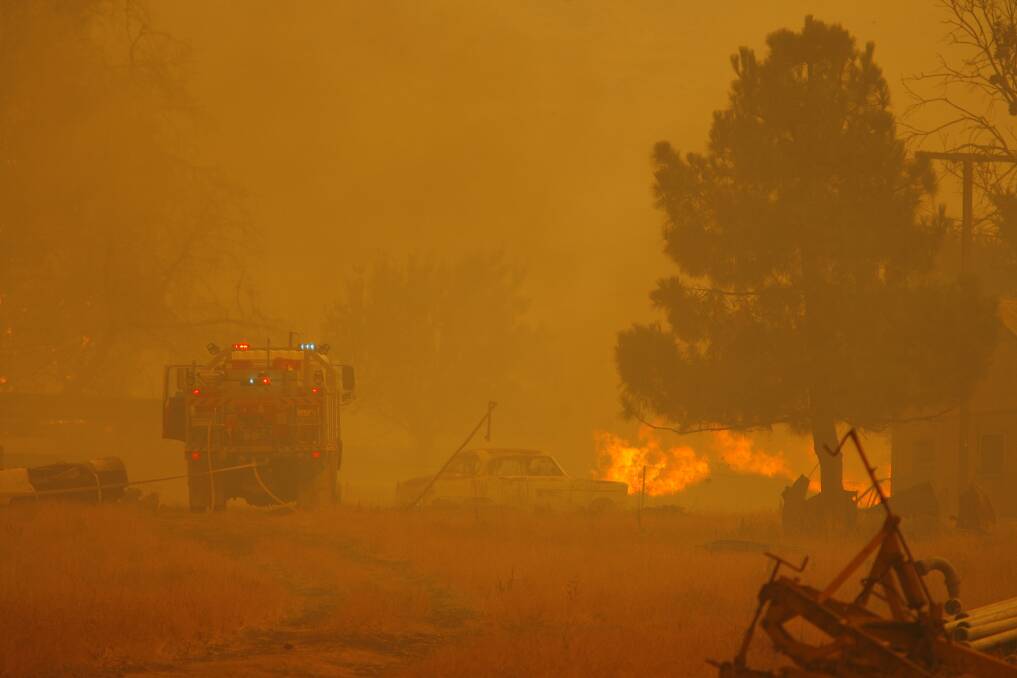 ALMOST 10 YEARS AGO: Firefighters on the scene of a fire near Dederang in February 2009.
