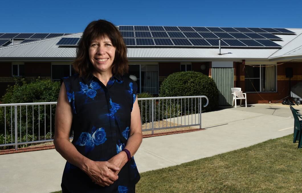 ENERGY LEADER: Rooftop solar panels are some of the energy-saving ways of the future for Yackandandah Health chief executive Annette Nuck and the town. Picture: MARK JESSER